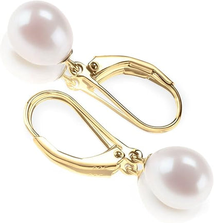 <p>Aretes colgantes con perla | Oro</p>