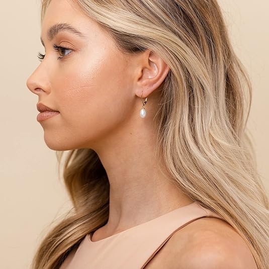 <p>Aretes colgantes con perla | Oro</p>