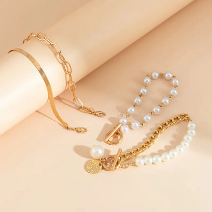 <strong>Conjunto de 4 Pulseras Chic - Serpiente, Perlas y Eslabones | Oro</strong>
